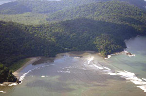 10 kilometers downstream, ocean waves break against the river current.